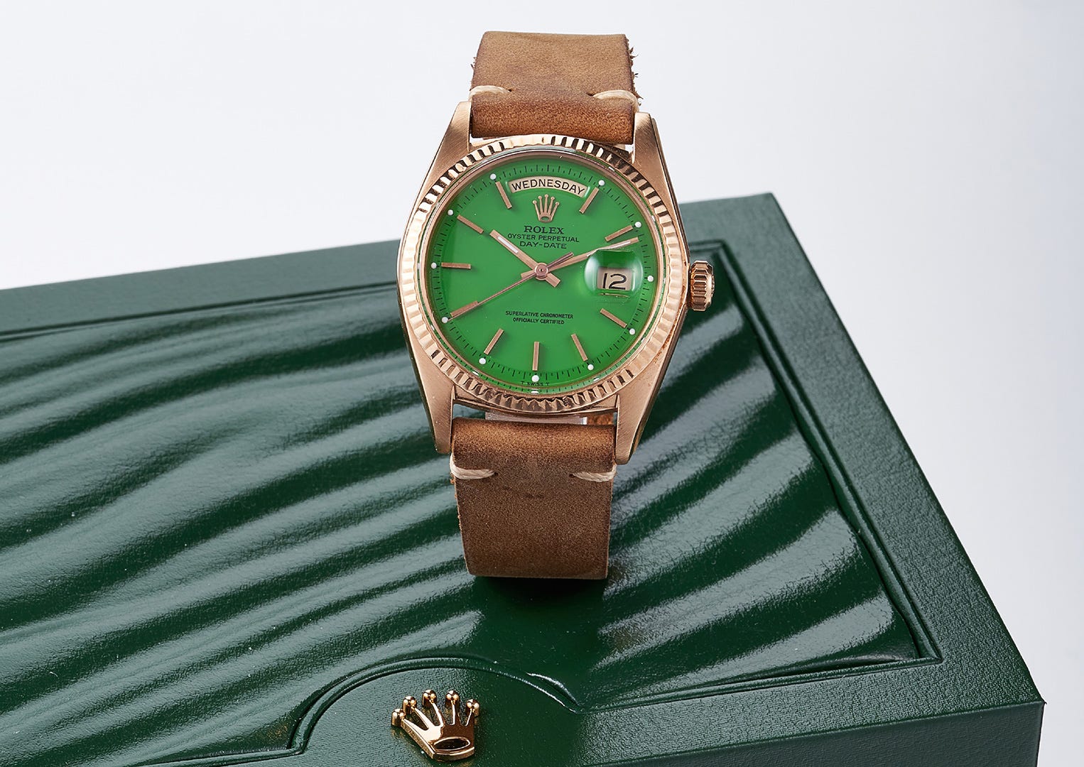 An early 1970s model in pink gold with leaf-green lacquered 'stella' dial. Image courtesy of Bonhams